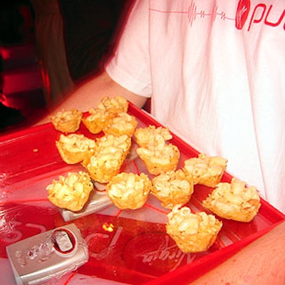Mood Food served hors d'oeuvres on trays with blinking red lights.