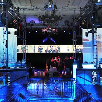 The interior of 48 Wall Street was transformed into a black box with constantly moving videos running horizontally around the room. In addition, four floor-to-ceiling screens anchored each corner.