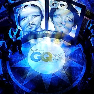 Two large blowups of GQ covers with award winners Colin Farrell and Adrien Brody stood in the entrance in front of two circular staircases leading to the after-party.