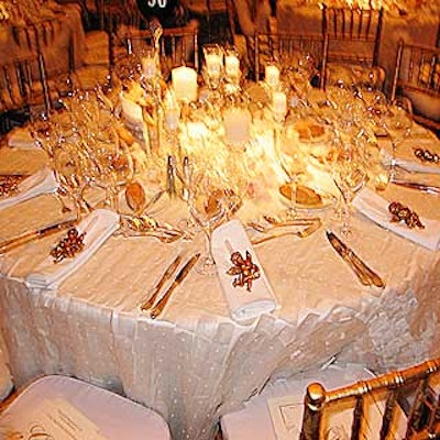 White patchwork organza cloths draped the tables. Crystal candlesticks and white cymbidium orchids added an ethereal effect.