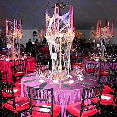 The Central Park Conservancy's Halloween Ball at Rumsey Playfield featured three different centerpieces created by Ron Wendt Floral and Event Design, including four-foot candelabras entwined with cobwebs.