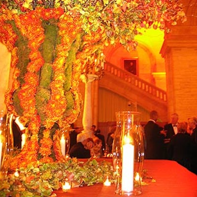 Designer David Monn decorated Astor Hall with a massive bouquet of autumn branches in a vase made of moss and mums.