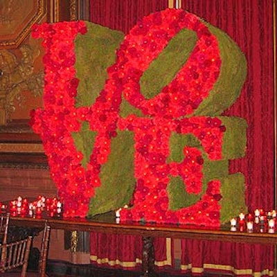 A red floral version of Robert Indiana's 'Love' sculpture served as a centerpiece at the Love Actually premiere party at the Metropolitan Club.