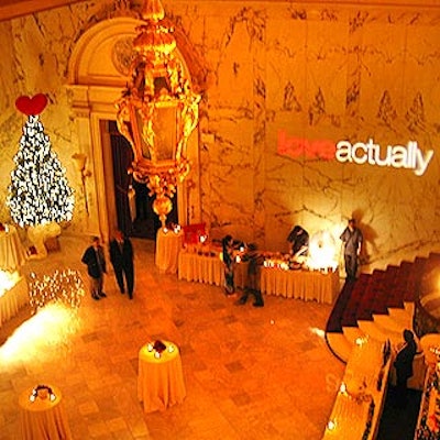 Bentley Meeker projected a full-color Love Actually logo onto the marble wall in the great hall, which also featured six cabaret tables and a twelve-foot Christmas tree topped off with a 28-inch red satin heart.