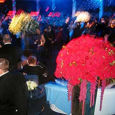 Avi Adler's giant bouquets of red and white flower arrangements added color to the mostly blue space.