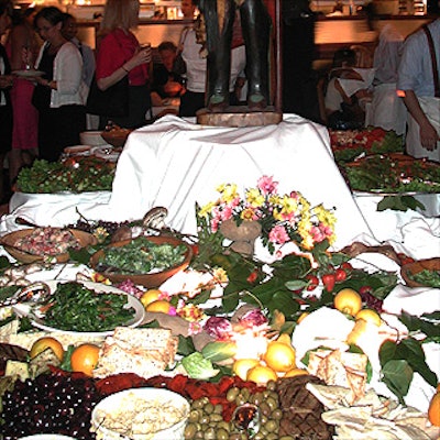 A large table of food including salads, grilled vegetables, breads and various antipasti provided by the restaurant dominated the main dining room of the new Angelo & Maxie's. (Photo by Anna Persson for BiZBash)