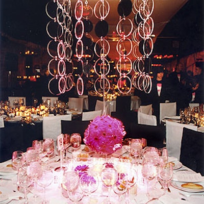 Antony Todd suspended Lucite chandeliers with clear and black discs over an assortment of dinner tables at the Solomon R. Guggenheim Museum's Pop Art ball.