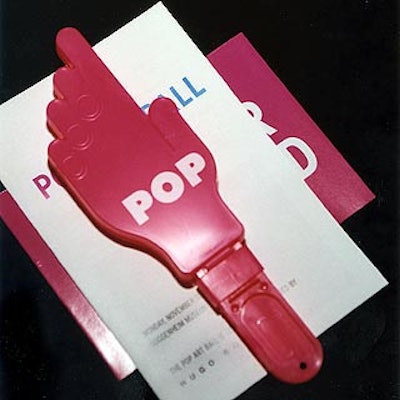 For the auction, Joe Rapp's hot pink hand-shaped noisemakers were printed with the word 'Pop.'