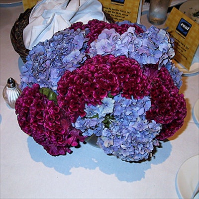 Floral centerpieces on the tables at the Jupiter Communications luncheon were by Accent on Flowers.