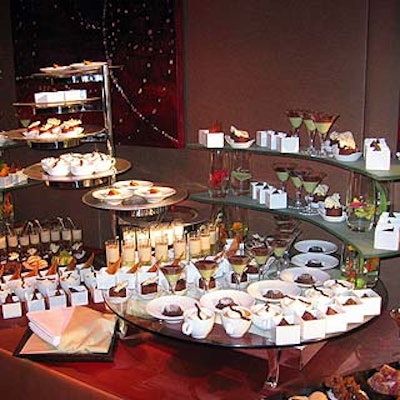 A tantalizing dessert station covered with desserts in single-serving containers covered a table in the ballroom foyer.