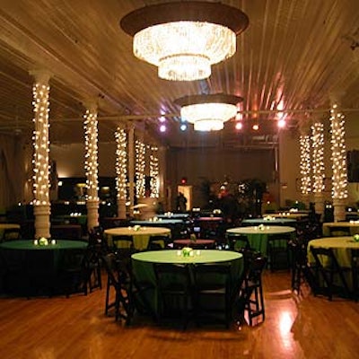 The main dining room featured 30 dinner tables illuminated by votives surrounded by ten poles decorated with white Christmas lights and flanked by buffet tables. The room also featured three bars and entertainment courtesy of Lucky Star Productions.