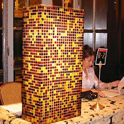 Mosaic tiled lightboxes illuminated the tables, which were covered with antique brocade fabrics.