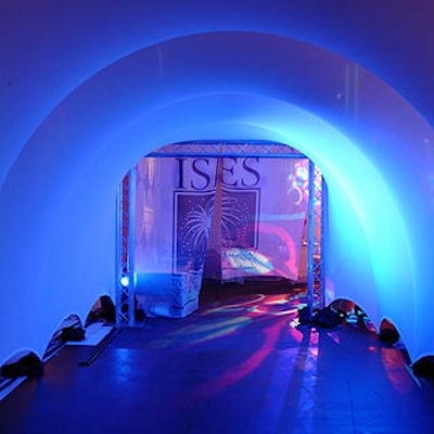 More than 150 attendees at the November meeting of the International Special Events Society's New England chapter entered the space through a neon-lit tunnel draped with sheer ISES-branded panels by Advanced Photographics.