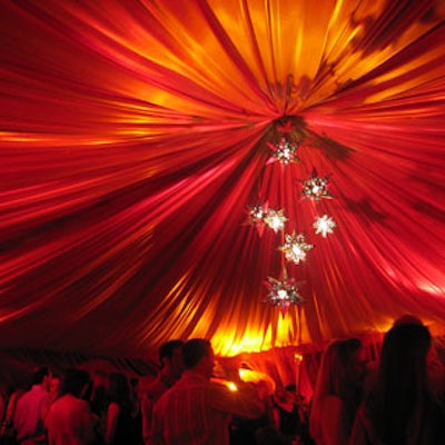The draped ceiling glowed with red light.