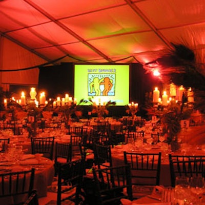 The Best Buddies logo stood out in the red-washed room.