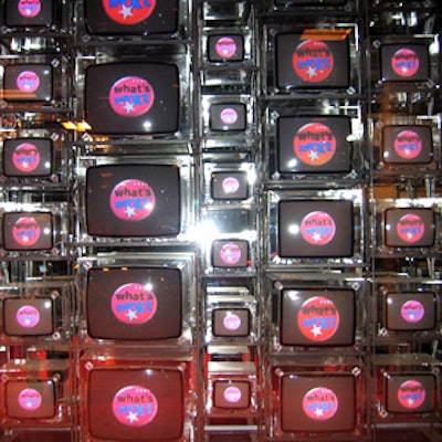 A wall of video screens greeted guests at the red carpet entrance to Crobar.