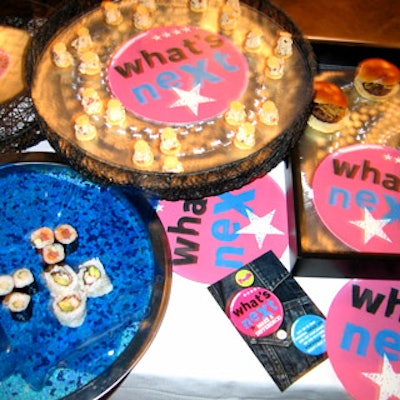 The Catering Company served food on trays branded with the What's Next logo.
