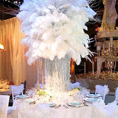 Tiffany's Robert Rufino designed a towering centerpiece of white feathers dripping with strings of iridescent beads and surrounded by small bunches of white flowers at the base, plus furry touches like a white rug and marabou boas draped the backs of the chairs.