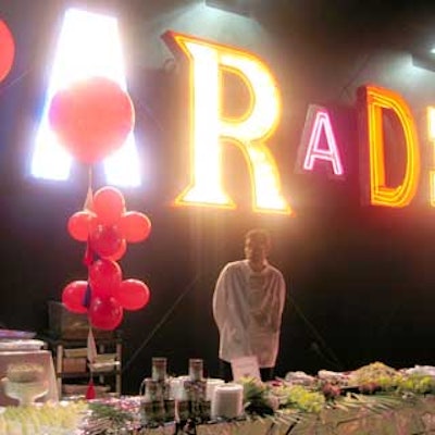 'Paradise,' a permanent exhibit attached to the outer wall of the building lit up in different colors and light patterns.