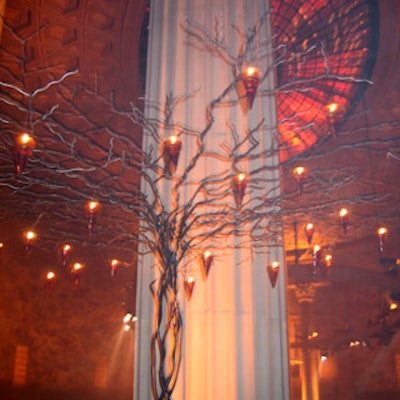 In the V.I.P. lounge, Tentation design director Keiko Sato hung amber votives from the branches of tree sculptures.
