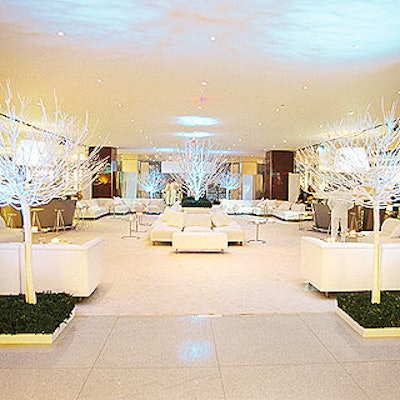 Designer David Monn created four stark lounge areas dotted with bare white trees. Monn lit the white decor in different colors throughout the evening, so the look changed from magenta to orange to turquoise and other hues.