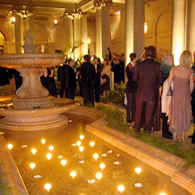 Kevin Krier & Associates decorated the fountain in the Garden Court with floating gardenias and white votive candles.