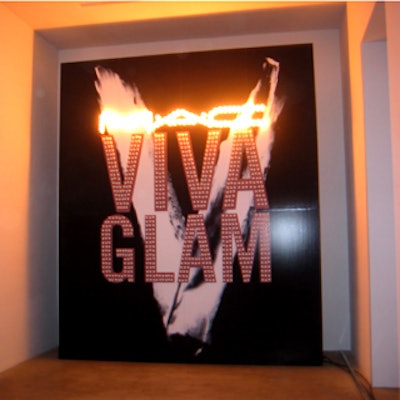 Two light-up signs at opposite ends of the Ace Gallery's foyer clearly announced the product behind the party: M.A.C. Viva Glam lip color.