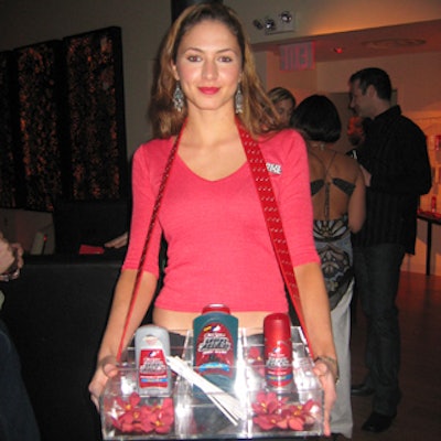 At Old Spice's Red Zone product launch at the Canal Room, models in red 'Red Zone' branded tops held cigarette tray-style boxes filled with the products for guests to sniff and spray.