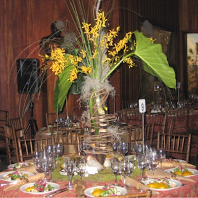 EventCo Productions covered tables with river rocks, Spanish moss and leaf-wrapped votives to go along with the earth milieu, while towering centerpieces were filled with lichen, philodendron leaves, James Story orchids and bear and zebra grass.