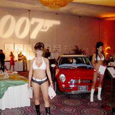 Bond girls walked around he silent auction assisting guests make charitable donations.