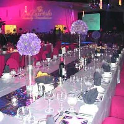 Table décor at the DeBartolo Foundation benefit consisted of shimmering lamé linens and flower arrangements by Pavilion Flowers.