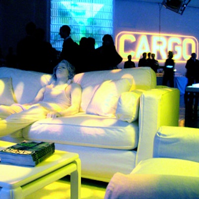 At Cargo magazine's launch event at Splashlight Studios, decor included a model dressed and painted in white lounging on white furniture.