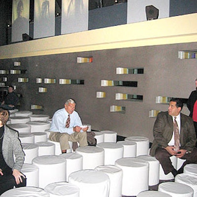 A long, narrow area for the press conference was filled with custom-made white ottomans. Posters of swimmers in the FastSkin II suit flanked both sides of the room.