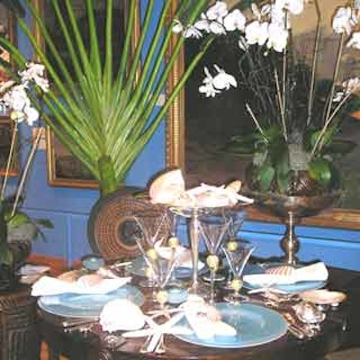 The Art of Table Decorating exhibit at the Lowe Art Museum showcased Tina Carlo and Courtney Parmenter's table display—appropriately titled, 'Elegant Evening by the Seashore,'—adorned with silver seashells and glass as blue as the ocean.