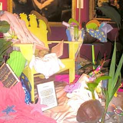 Beyond the table, these designers used white sand, starfish, live palms and a beach chair to outfit their beachside picnic setting.