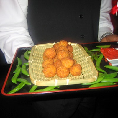 Show's black lacquer serving trays were decorated with pea pods and wicker baskets.