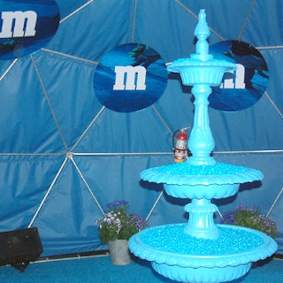 The blue tent that served as the event space's entrance contained a fountain filled with blue M&M's.