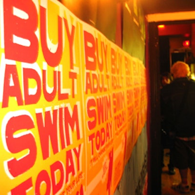 'Adult Swim' signage papered the walls at a party for the Cartoon Network's media buyers and planners at the Knitting Factory.