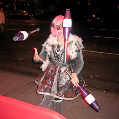 A juggler performed for people in line outside the Tenth Avenue club.