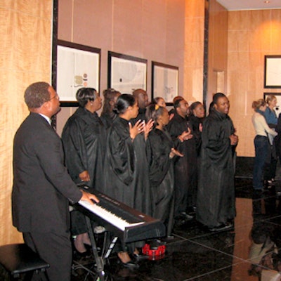 Members of the Harlem Gospel Choir kept guests from getting bored while waiting for the elevators up to the 70th floor at the Residences at the Mandarin Oriental.