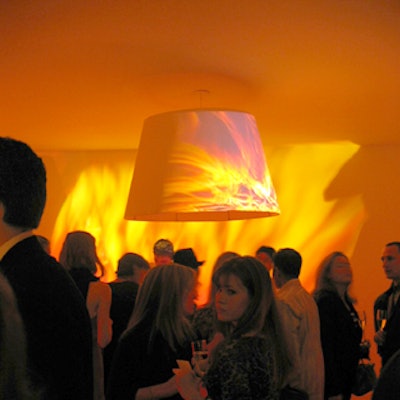 David Monn hung a giant lamp shade and projected images of flames in one room.