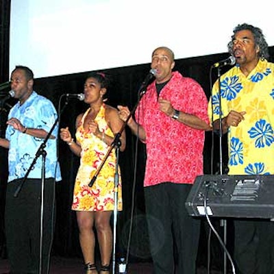 A steel band accompanied by brightly outfitted vocalists provided upbeat entertainment when guests moved onto the dance floor after dinner.