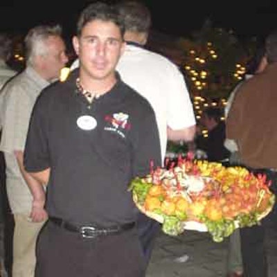 A server showed off his tasty dish which included tostones (fried plantains), maduros (sweet plantains) and ham croquettes.