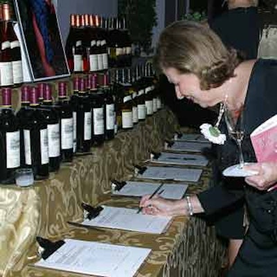 Guests were encouraged to bid on their favorite bottle of wine at Florida Grand Opera's wine auction at the Surf Club, where several hundred labels were on display.