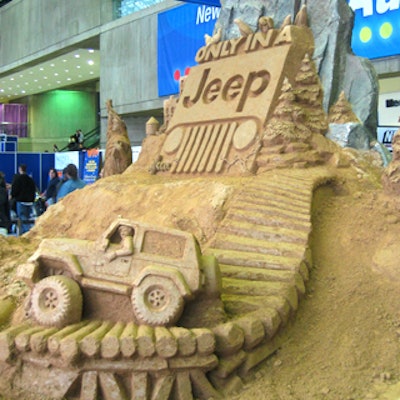 A Jeep-branded sand sculpture from Team Sandtastic sat on the north end of the Javits Center at the New York International Automobile Show to direct guests to the car company's Camp Jeep New York area outside the main building in the North Pavilion.