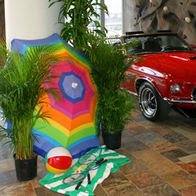 The beach-inspired area included colorful decor by Matthew David that complemented a red Mustang.