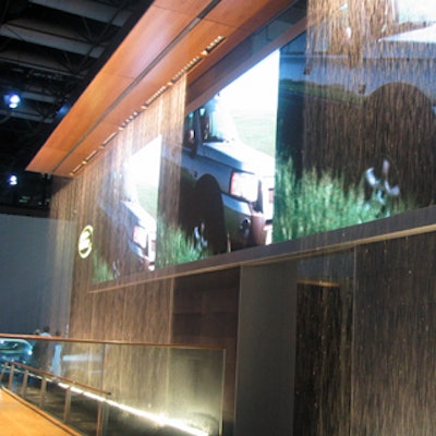 Land Rover's display featured a water wall in front of flat-screen monitors that played videos of the cars.