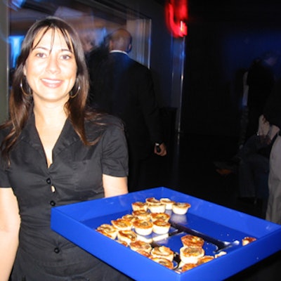 Concorde's staff served snacks catered by the venue like sashimi on filo dough, chicken satay with peanut sauce and mini pizzas on square blue trays featuring the signature H.