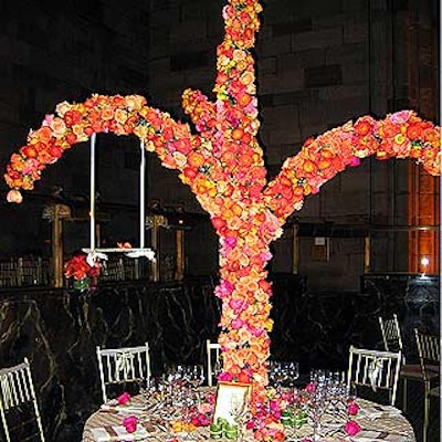 For the Horticultural Society of New York's benefit at Cipriani 42nd Street, Studio Sweet Pea worked with Carlton Finneral Mahoney Design on a 'Giving Tree' centerpiece, which featured curving branches covered with a warm array of roses, peonies, calla lilies and other blooms, and a swing suspended from white ribbon hung from one of the arms.