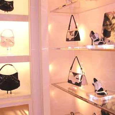 Set against blush-colored walls and washed in rose-tinted lighting, pink lace-up handbags and pink spectator shoes were just part of the 'D' Trick couture collection.